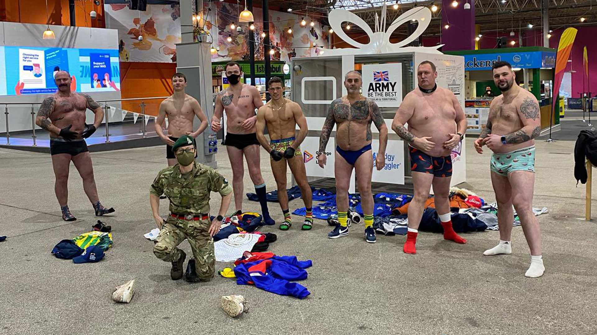 The rugby team stood with their kit off