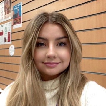 A photo of Chloe smiling at the camera