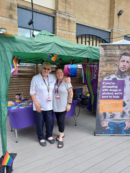 Two women stood under a gazebo