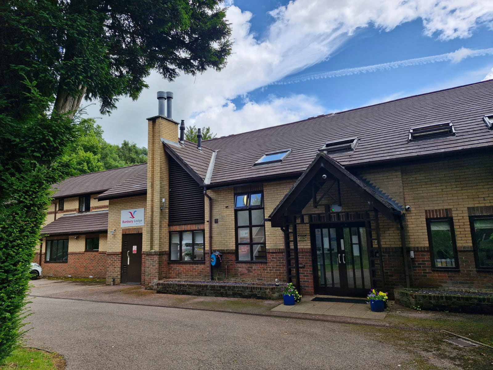 The outside of a building with a glass entrance.