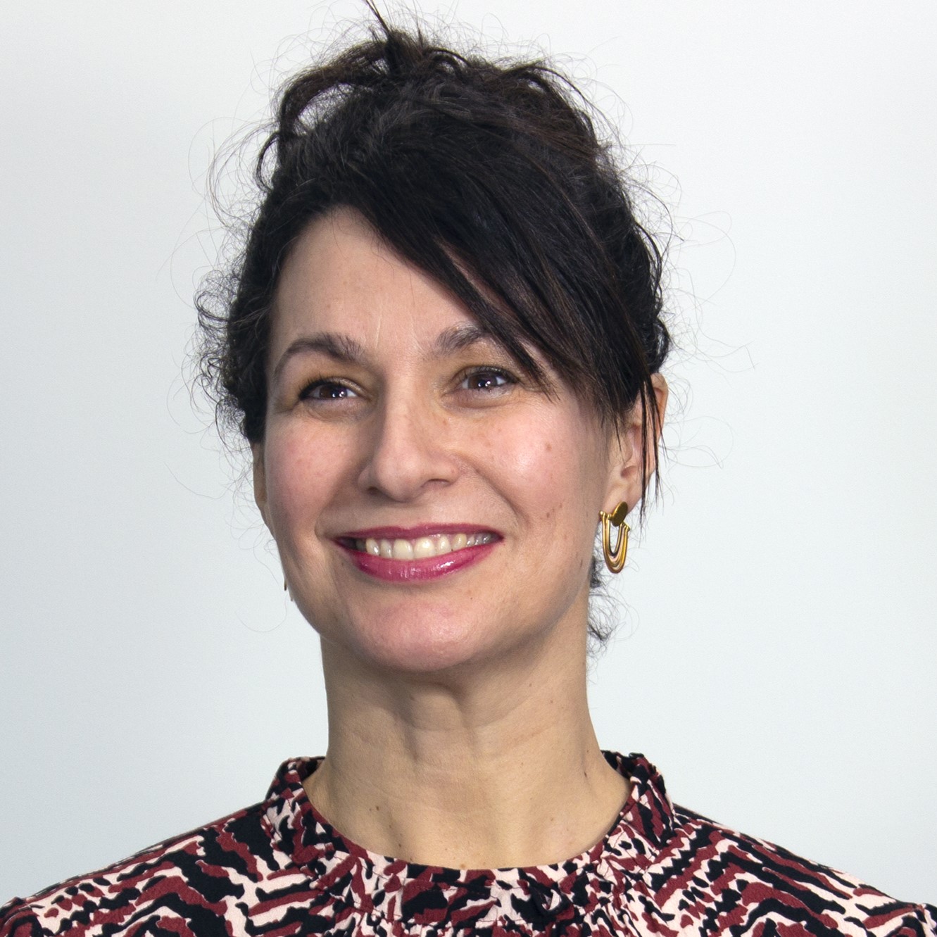 Angelene, our Trustee with her hair up and smiling