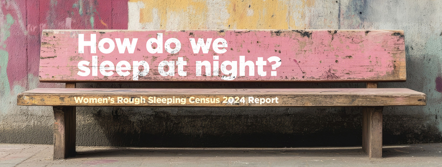 a colourful empty bench with the words How do we sleep at night? written on it