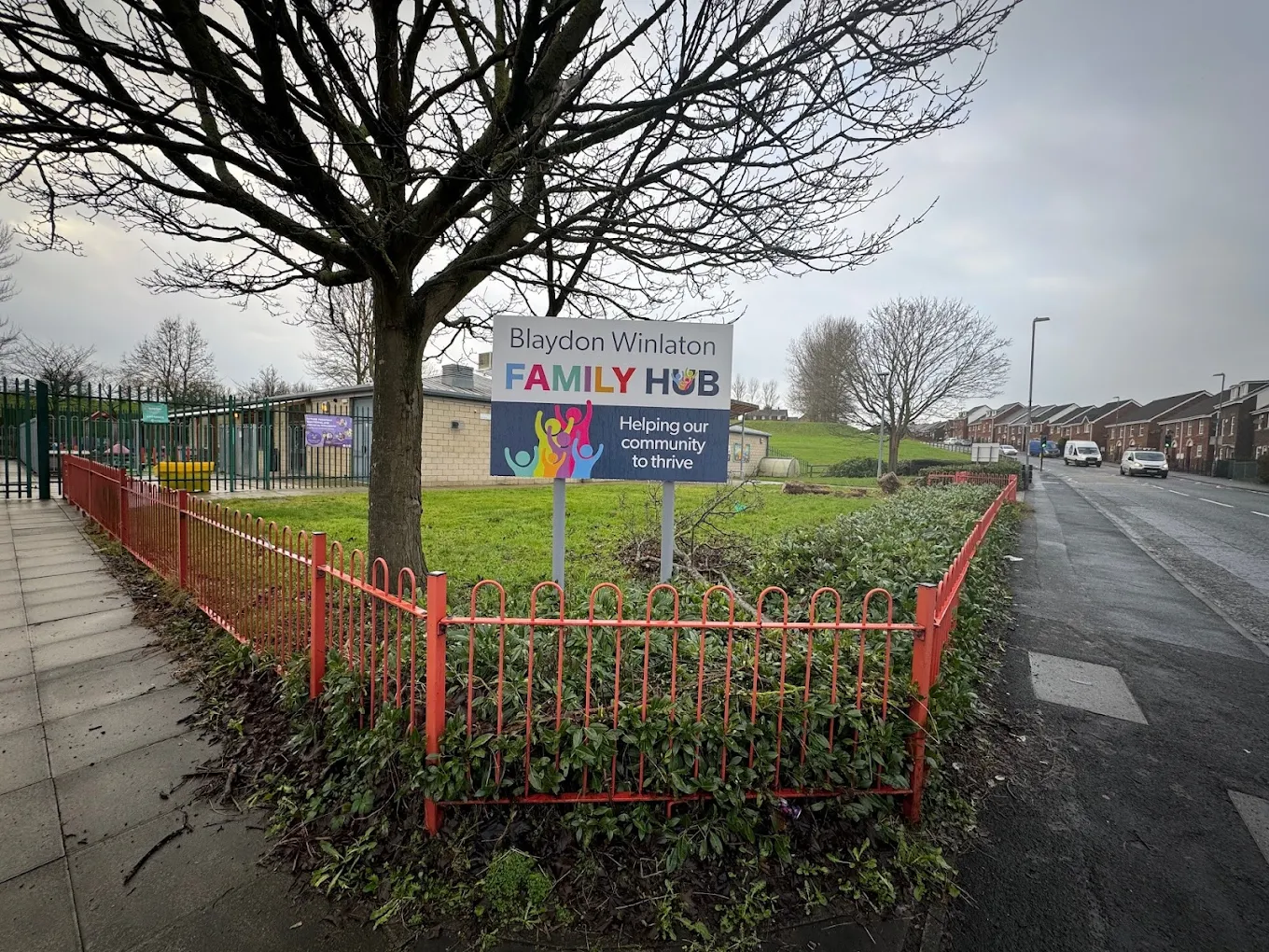 A sign for Blaydon Family hub underneath a tree