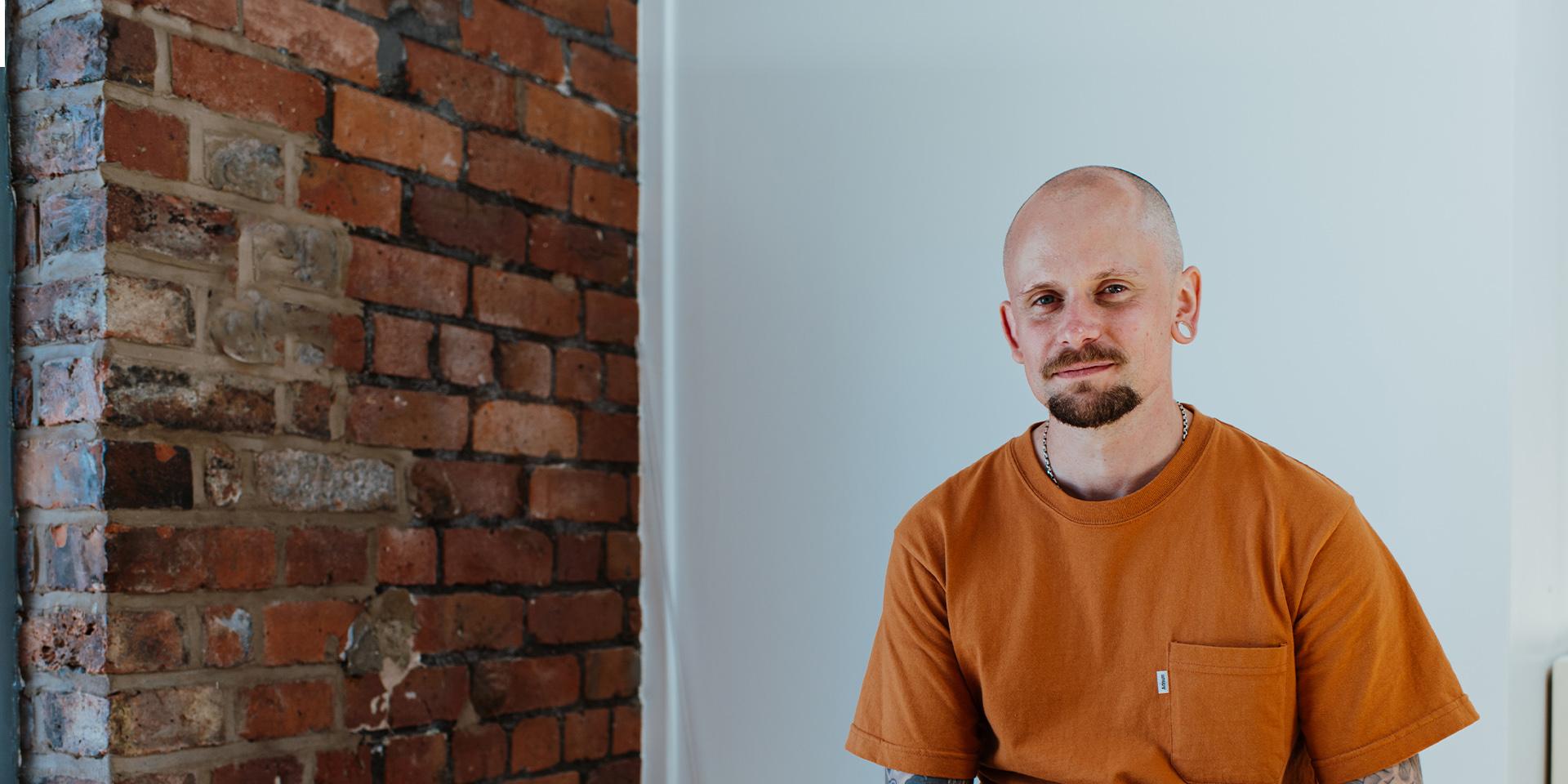 A person slightly smiling at the camera