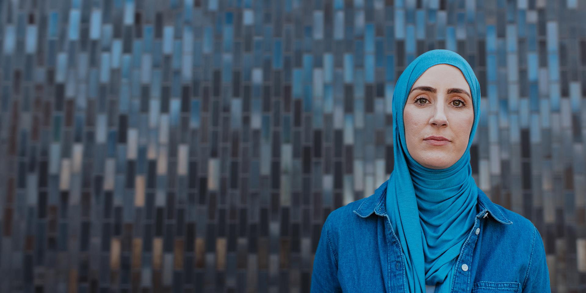 A person looking at the camera with a serious expression