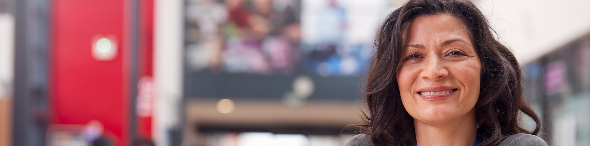 A smiling woman with brown hair