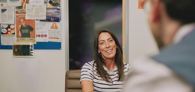 a person talking to someone out of camera view